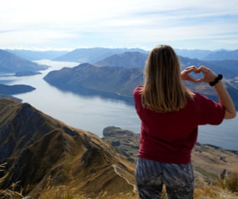 Image of Mathias standing on top of a mountain