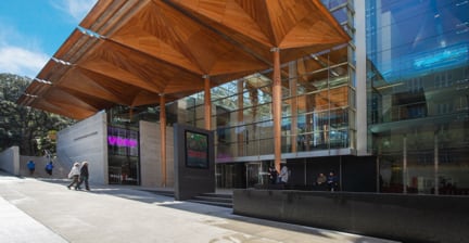 Modern building entrance with wooden canopy in Auckland