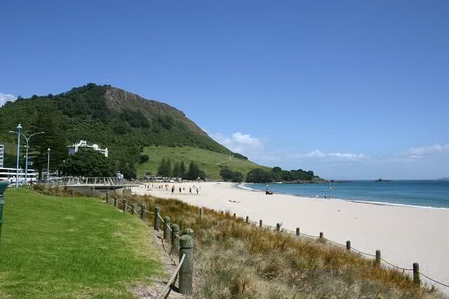 Image of the beach at Tauranga with Mount Maunganui in the background